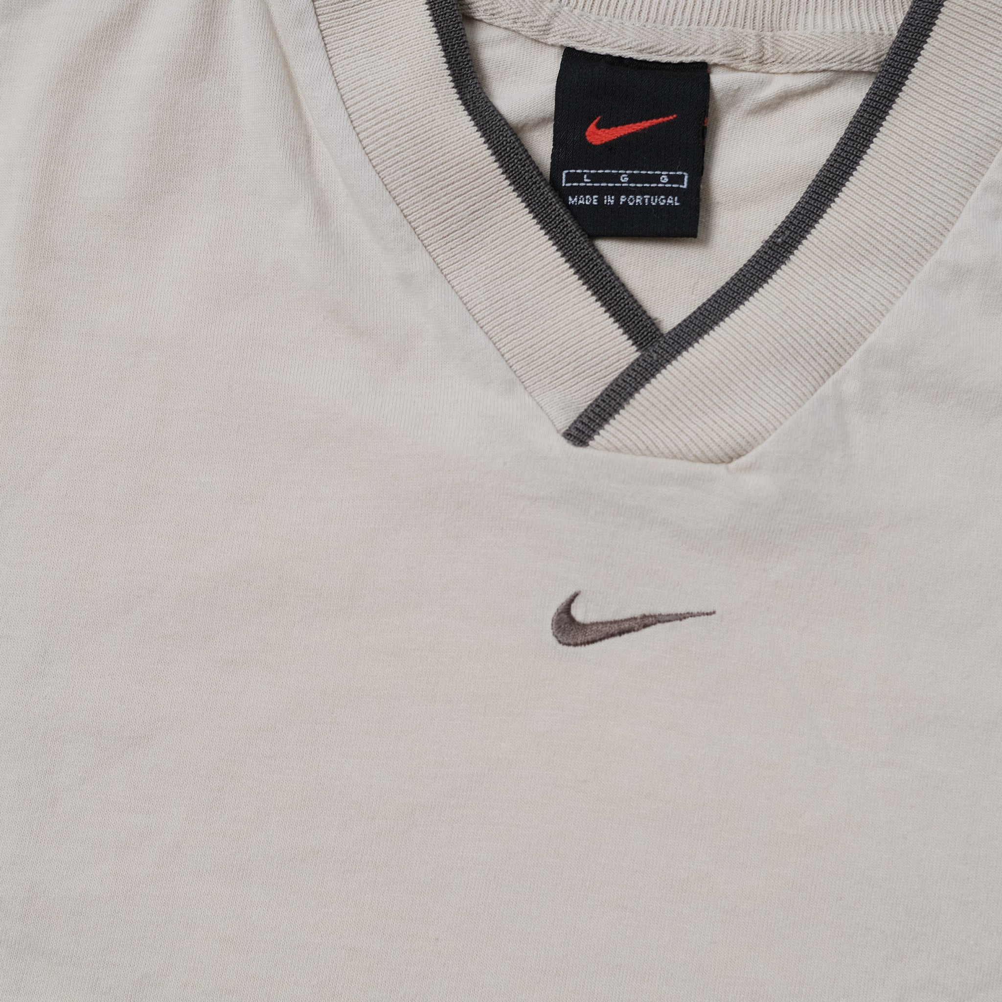 nike shirt swoosh on collar