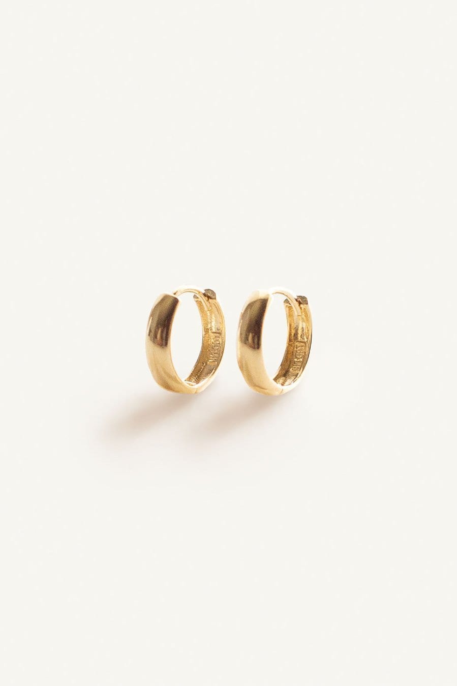 Mini Hoop Huggie Earrings by Kinn 