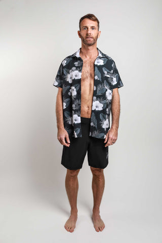 Man wearing Hakuna unisex rash guard shirt in Aloha print made out of board short material