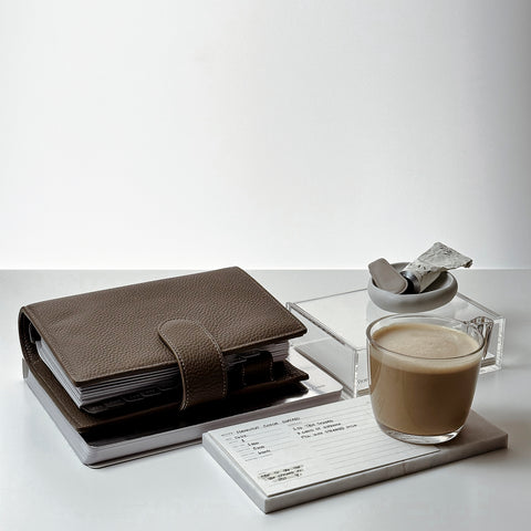 Brown planner on desk