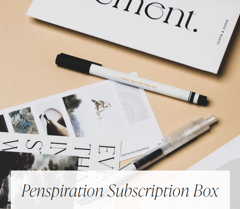 Penspiration Subscription Box: photo of two pens with black and white detailing, and various journaling cards