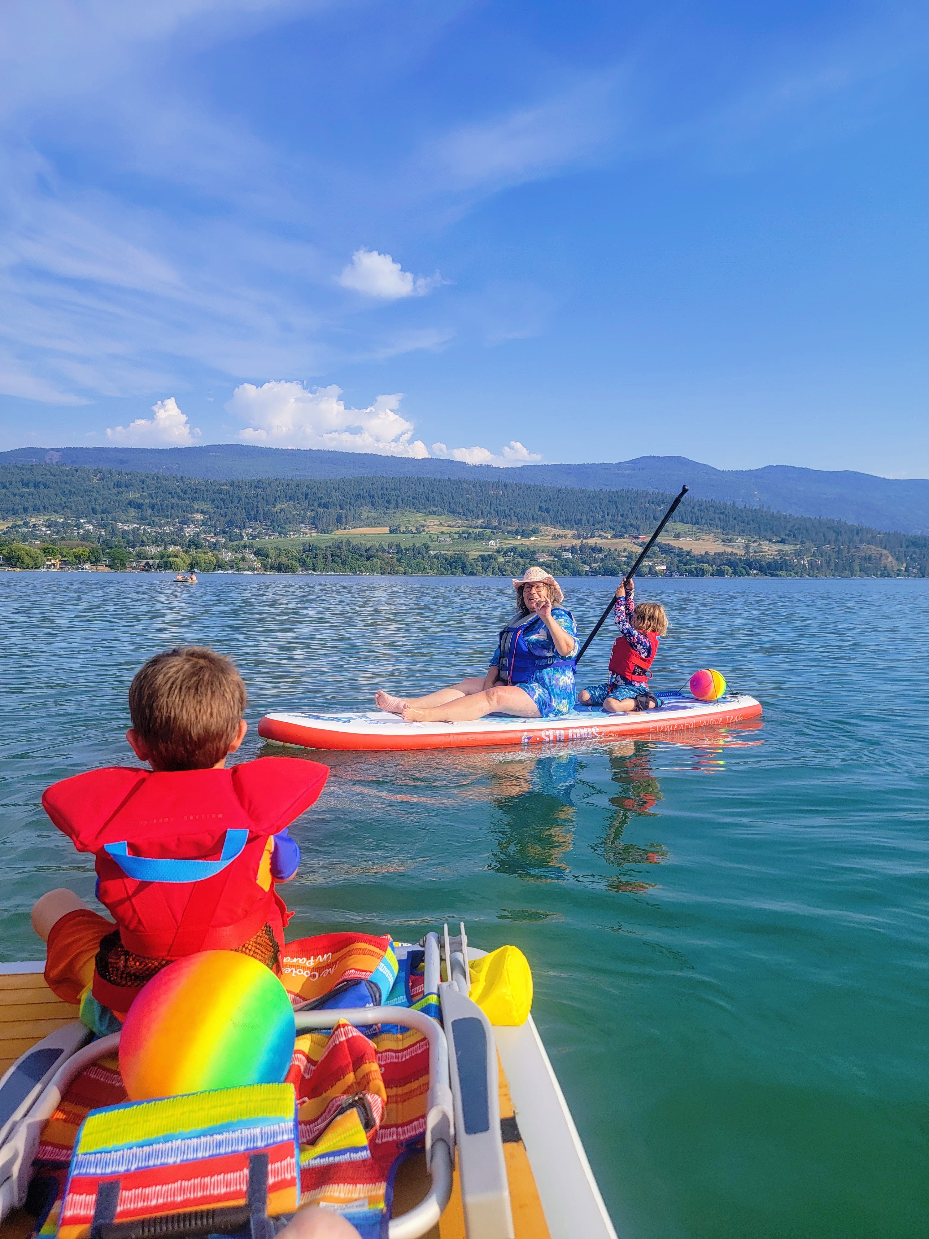 Grand parent on Sea Gods inflatable Dock and Sea Gods paddle board