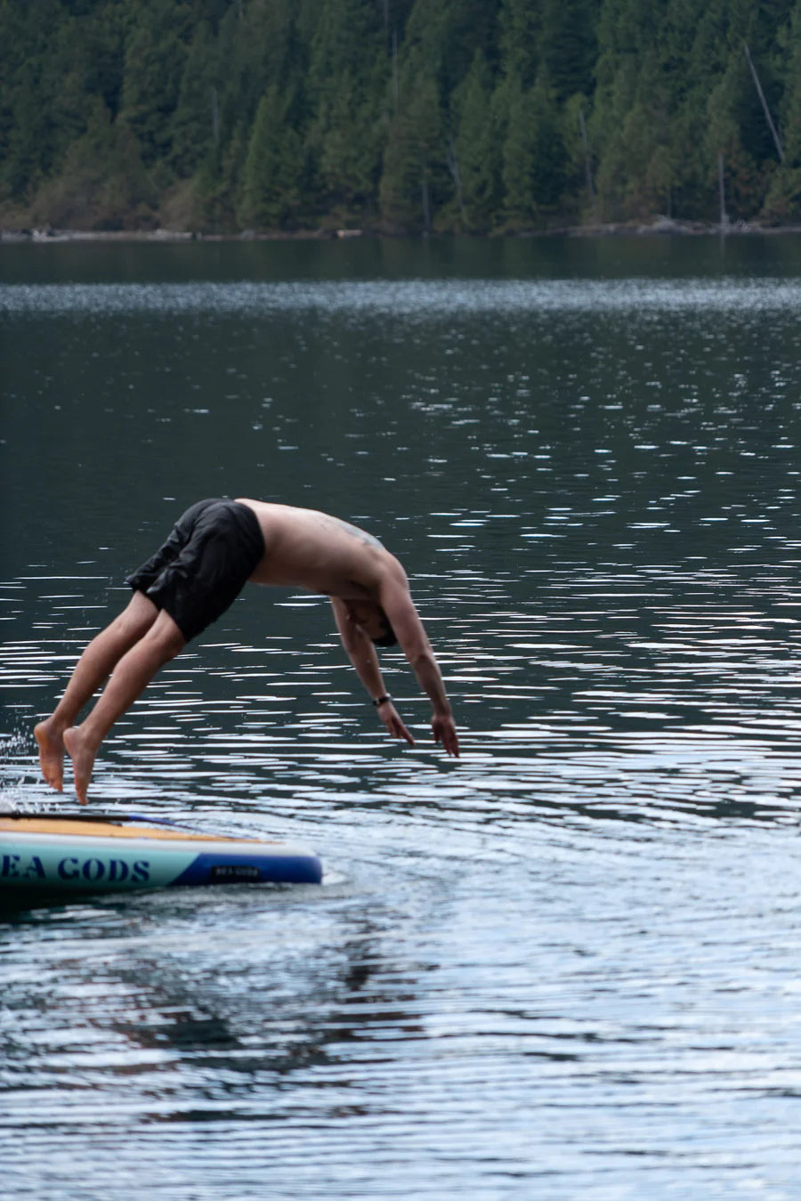 Man diving from Agora floating Dock into the water