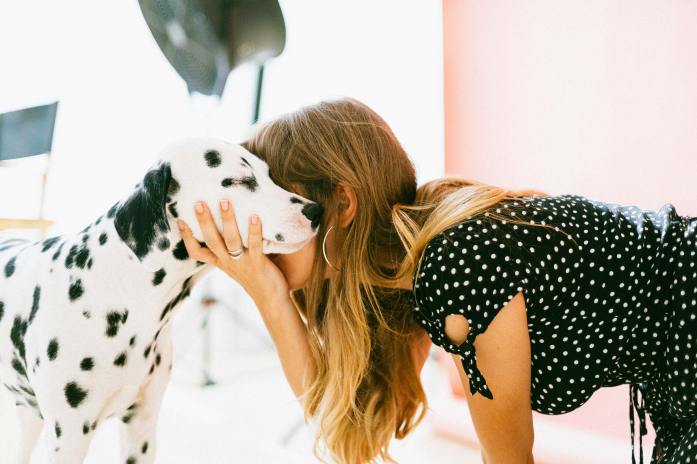 women hugging Dalmatian