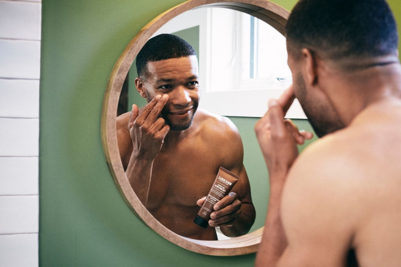 Man applying skincare products