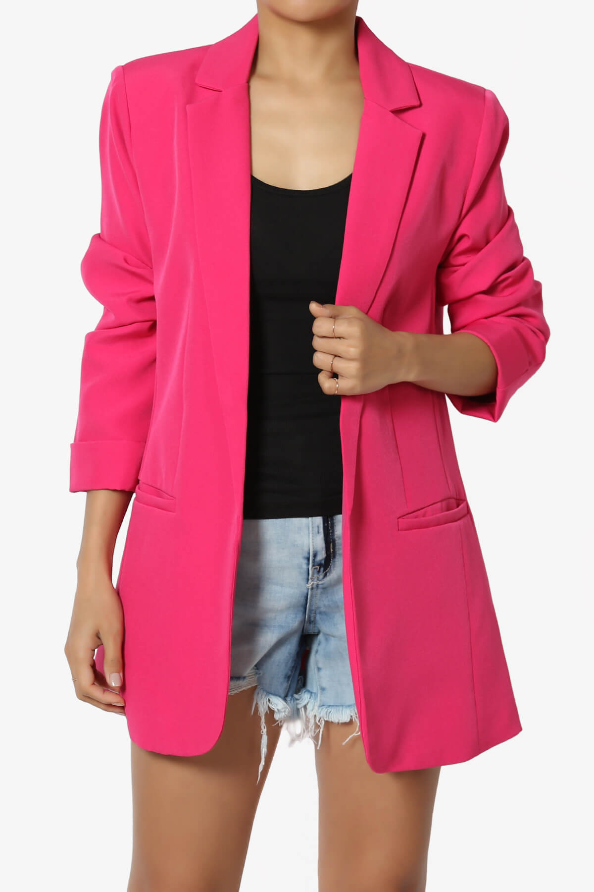 A woman wearing a pink blazer