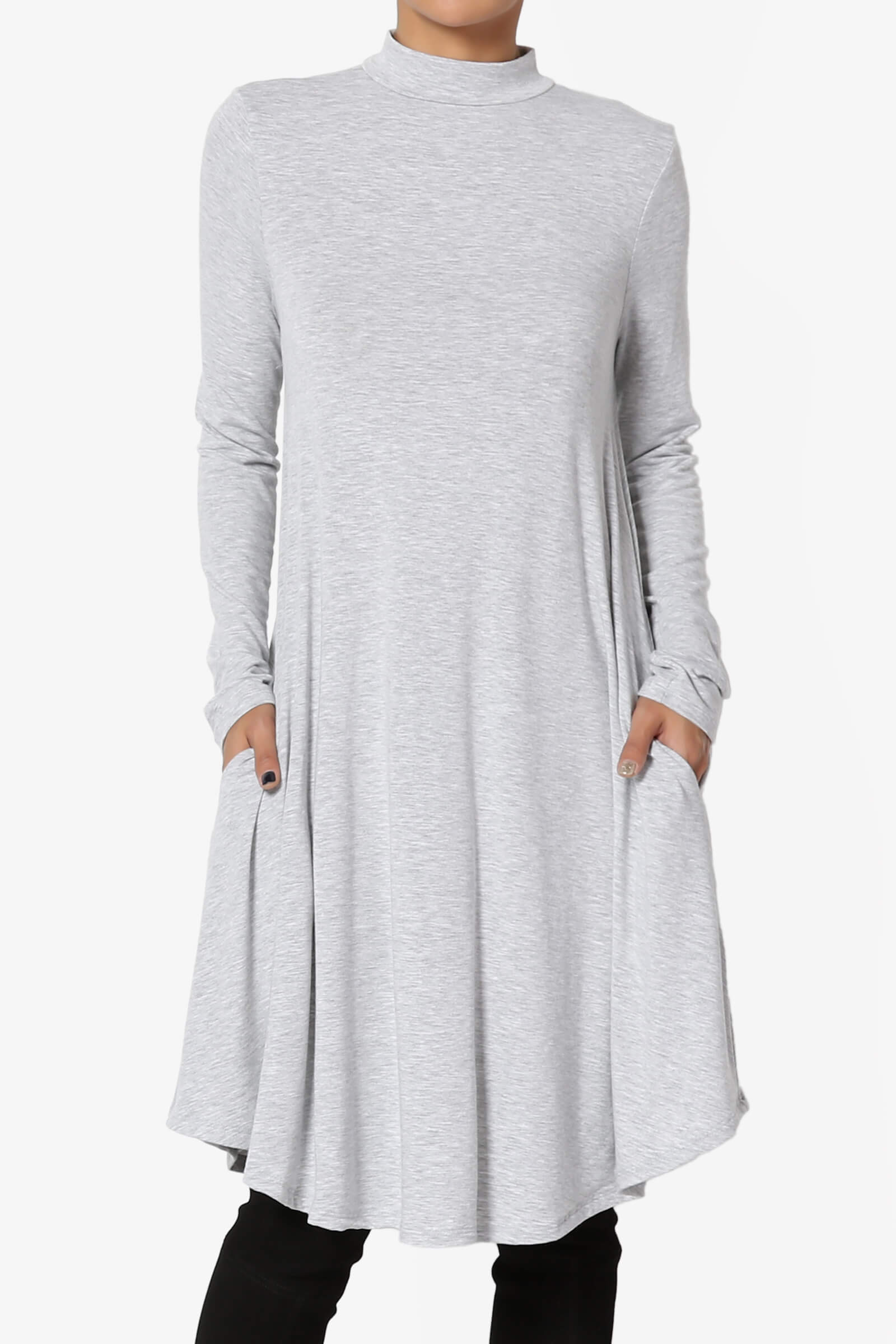 A woman wearing a gray turtleneck dress