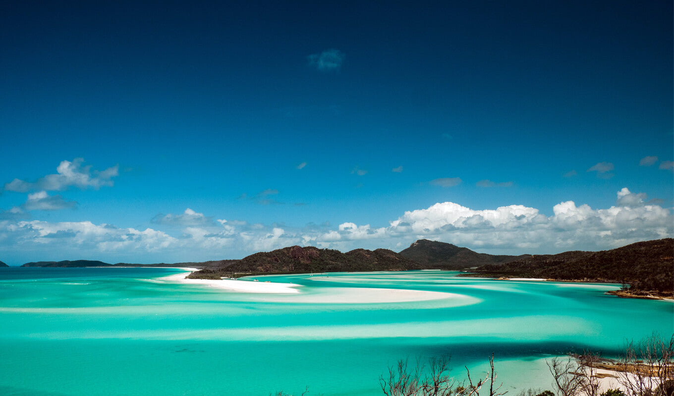 Crystal clear sea water bay. Pristine ocean lagoon sunny cloudy