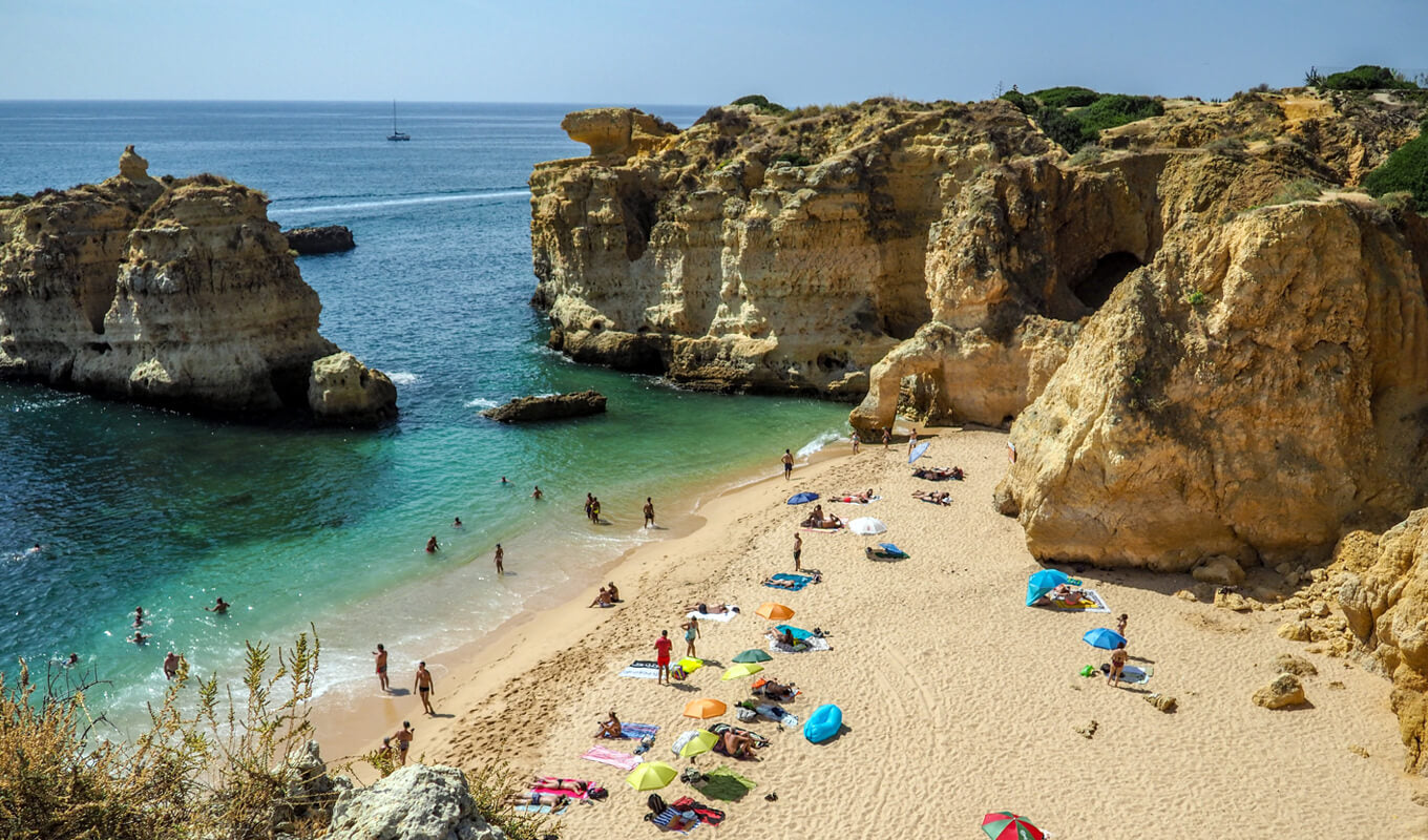 People enjoying the beach of Algarve, Portugal