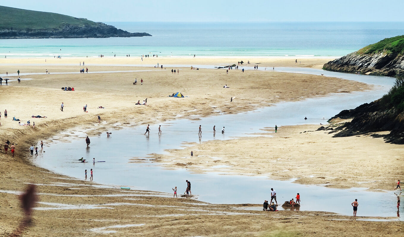 People on gannel river flows to crantock beach