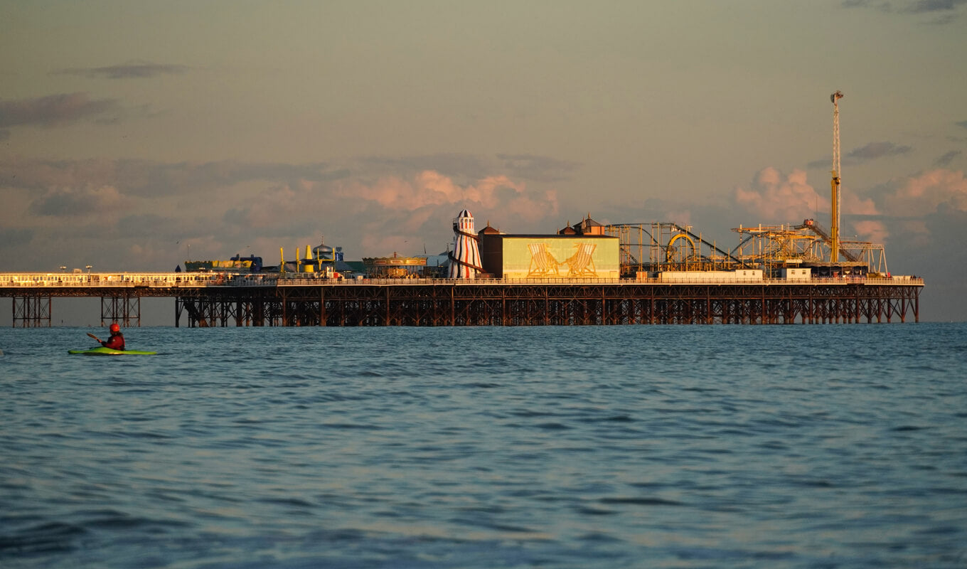 Kayaker near an amusement park