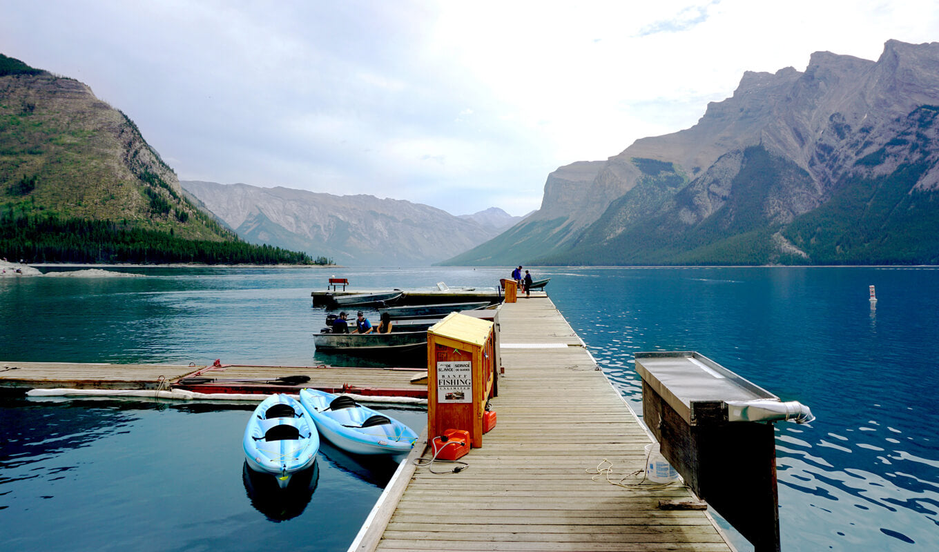 Blue kayak docked at Lake Minnewanka, Calgary