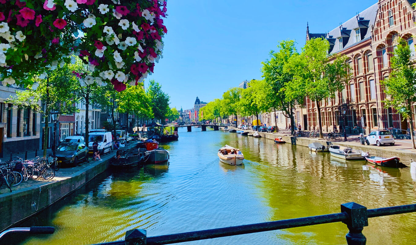 Boat at the river of Amsterdam Canal, Netherlands