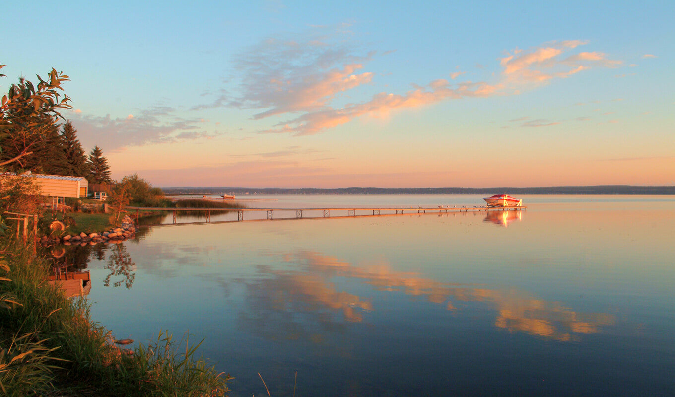 Boat in the middle of the Wabamum Lake, Edmonton Canada