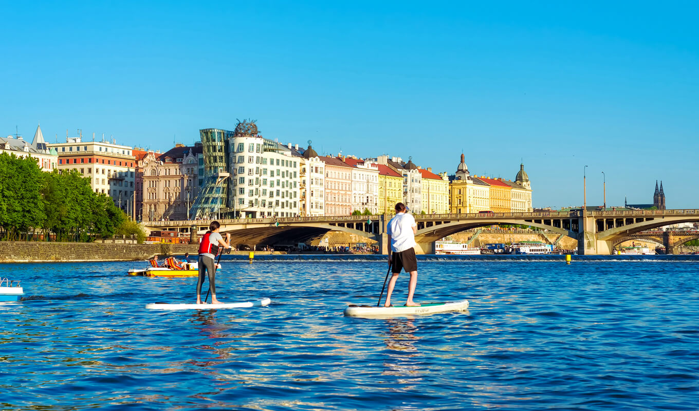 Paddle boarders at Vltava river Prague