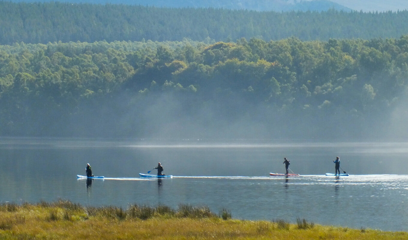 Paddle boarders at Loch Tulla