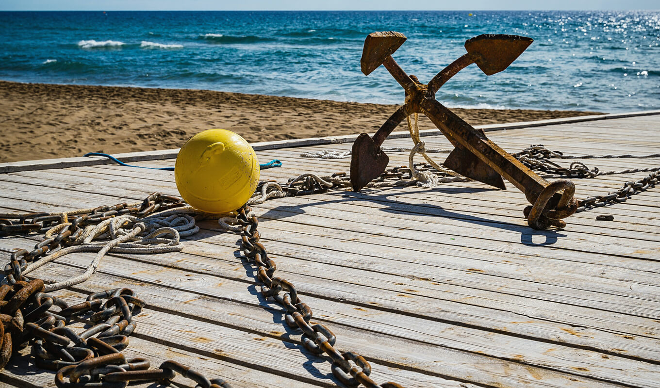 Yellow buoy and rusting anchor