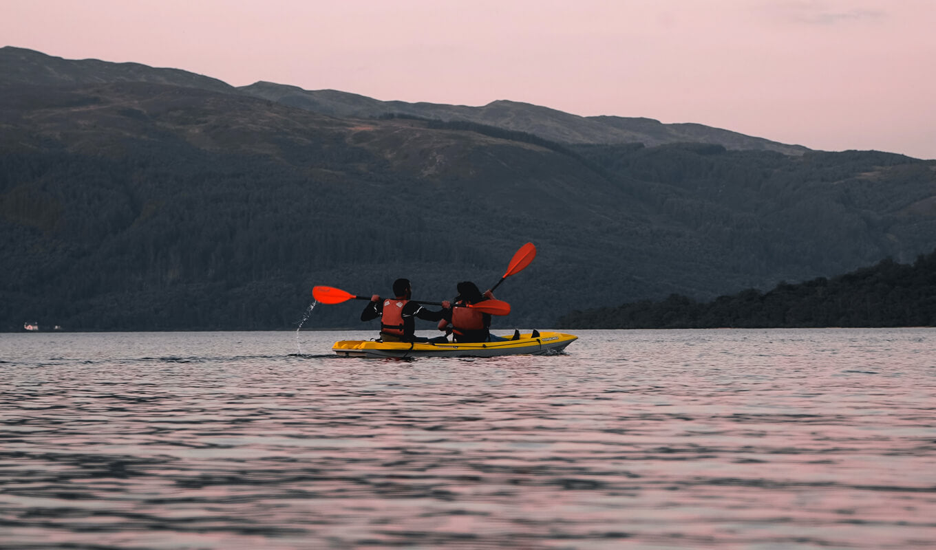 Man and a woman on a tandem kayak