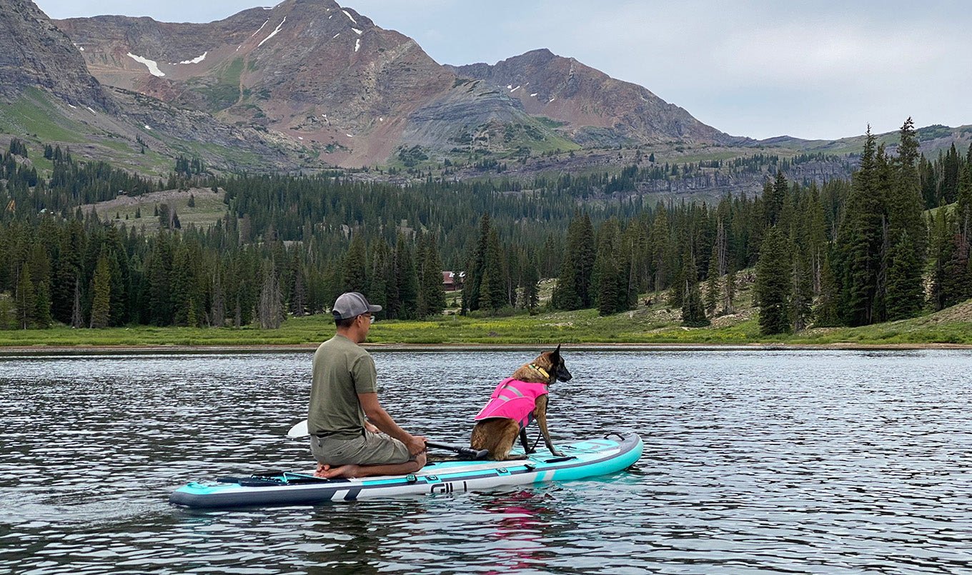 Best paddle board for dogs - man kneeling