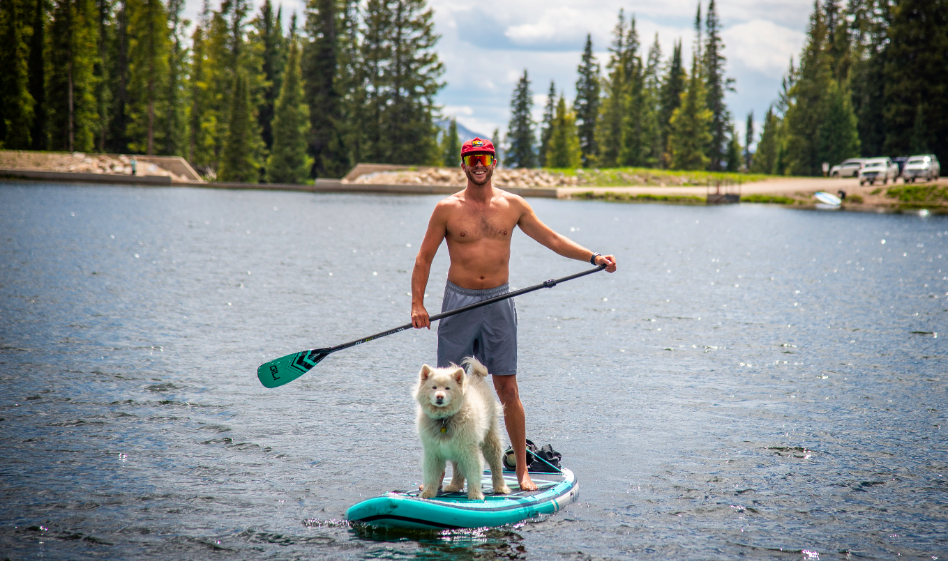 Best paddle board for dogs - smiling man