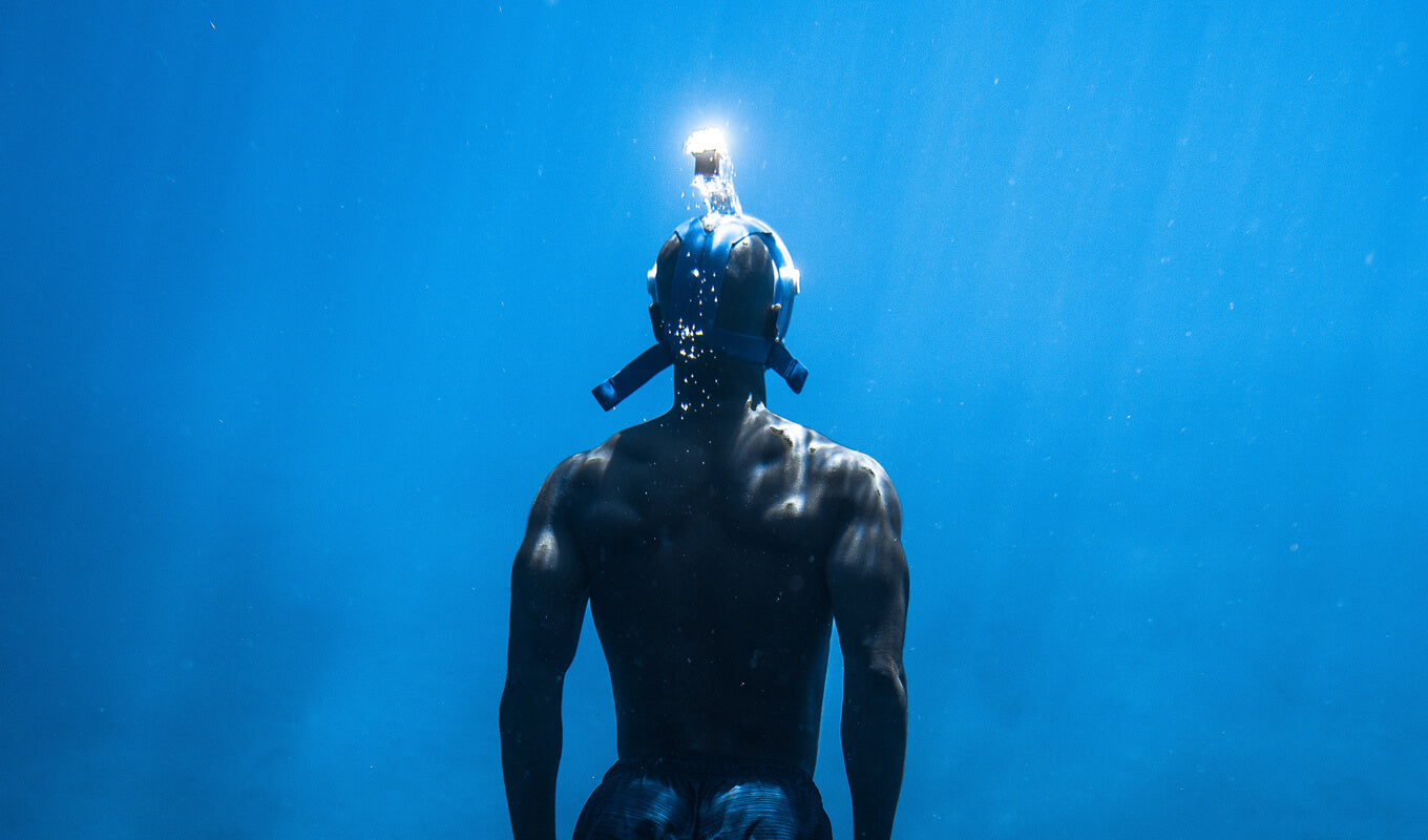 Man snorkeling using a full face mask
