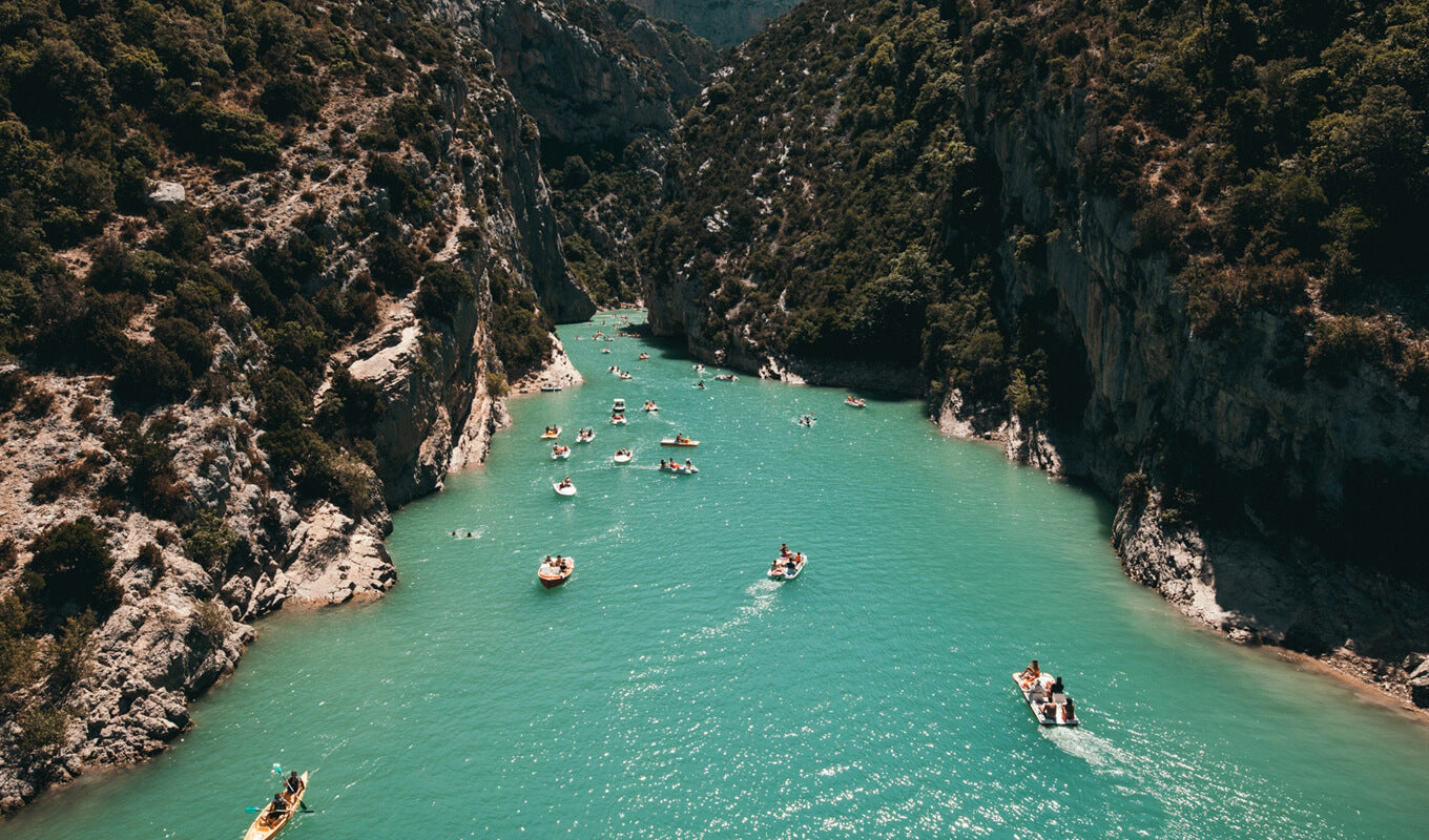 Kayak and boats anchored on the river