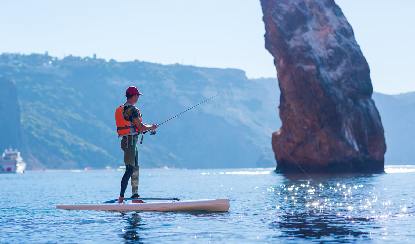 Man fishing with a life jacket