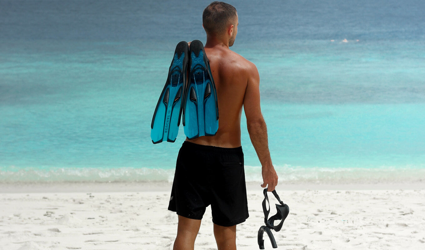 Man holding his snorkeling gear