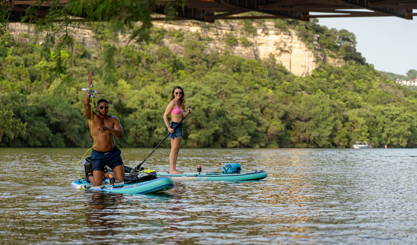 Man throwing his anchor while on paddle board