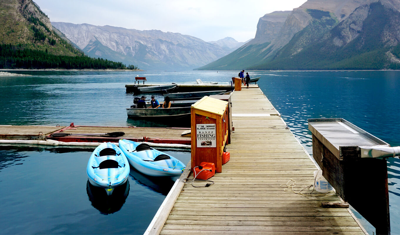 two blue kayak docked and anchored