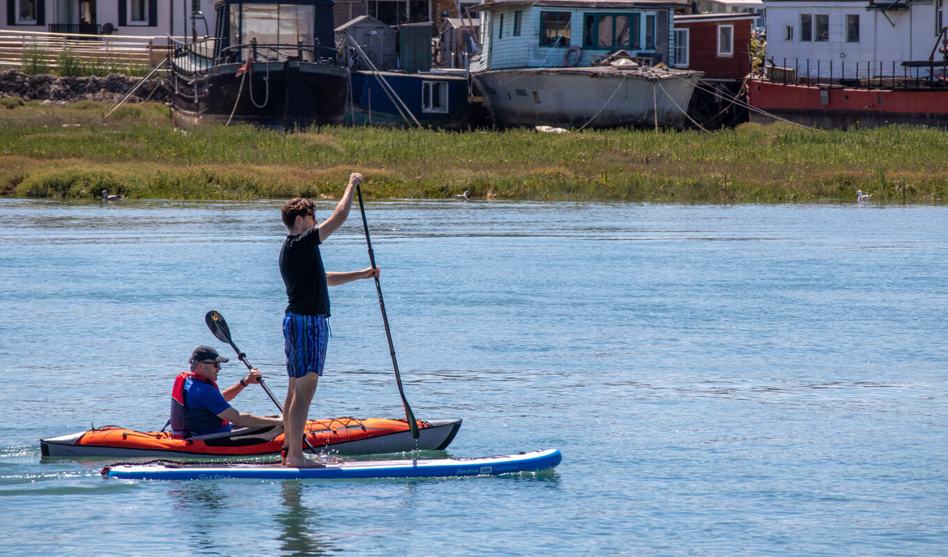 Two man on a inflatable kayak and inflatable SUP