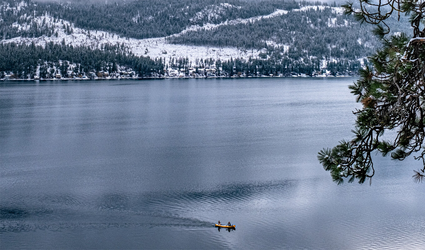two man canoeing at kalamalka lake BC