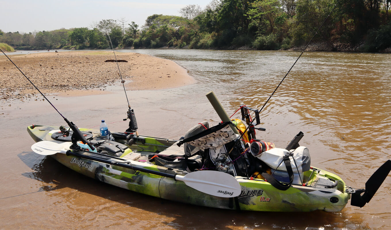 A row of fishing rods sitting on top of a boat photo – Free