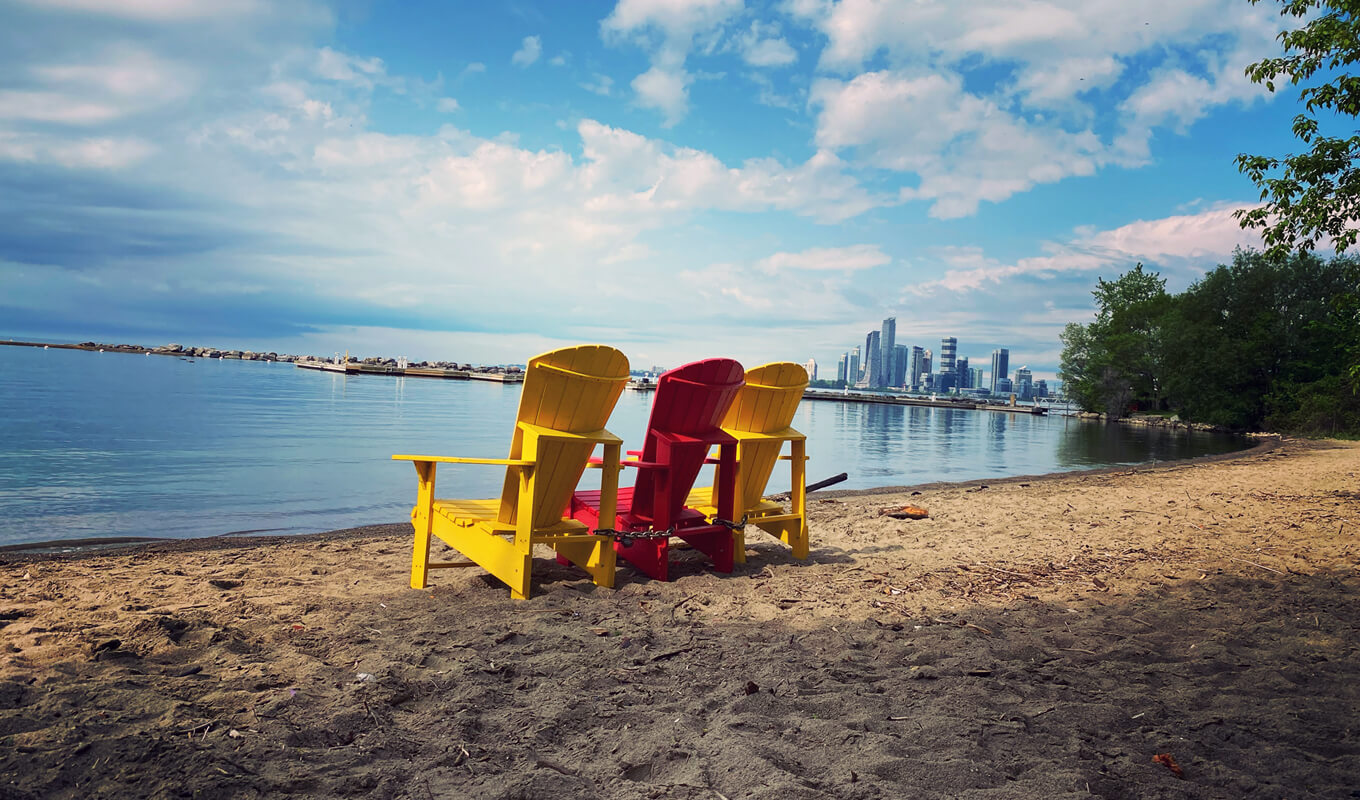 Three colorful wooden beach chair at Marilyn Bell Park