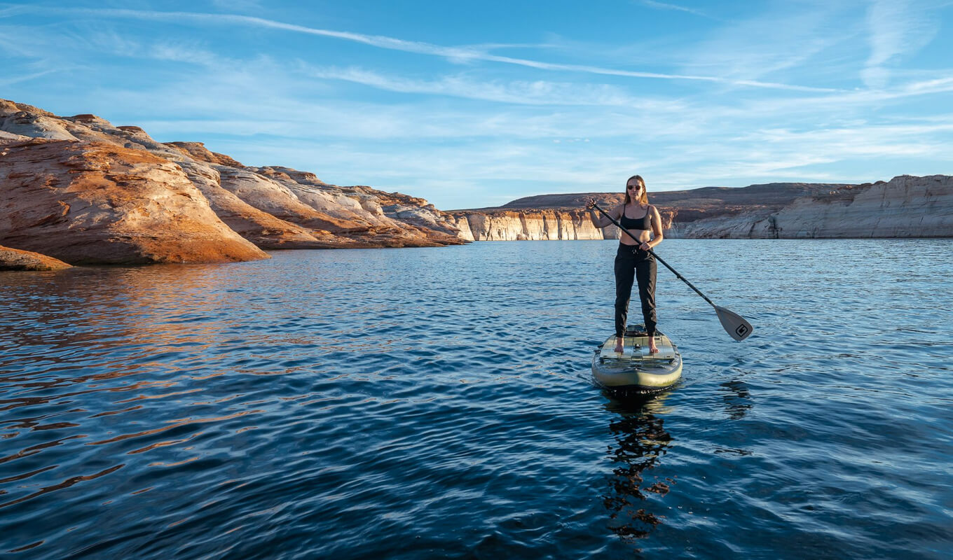 Woman paddling on a gili adventure board in lake powell
