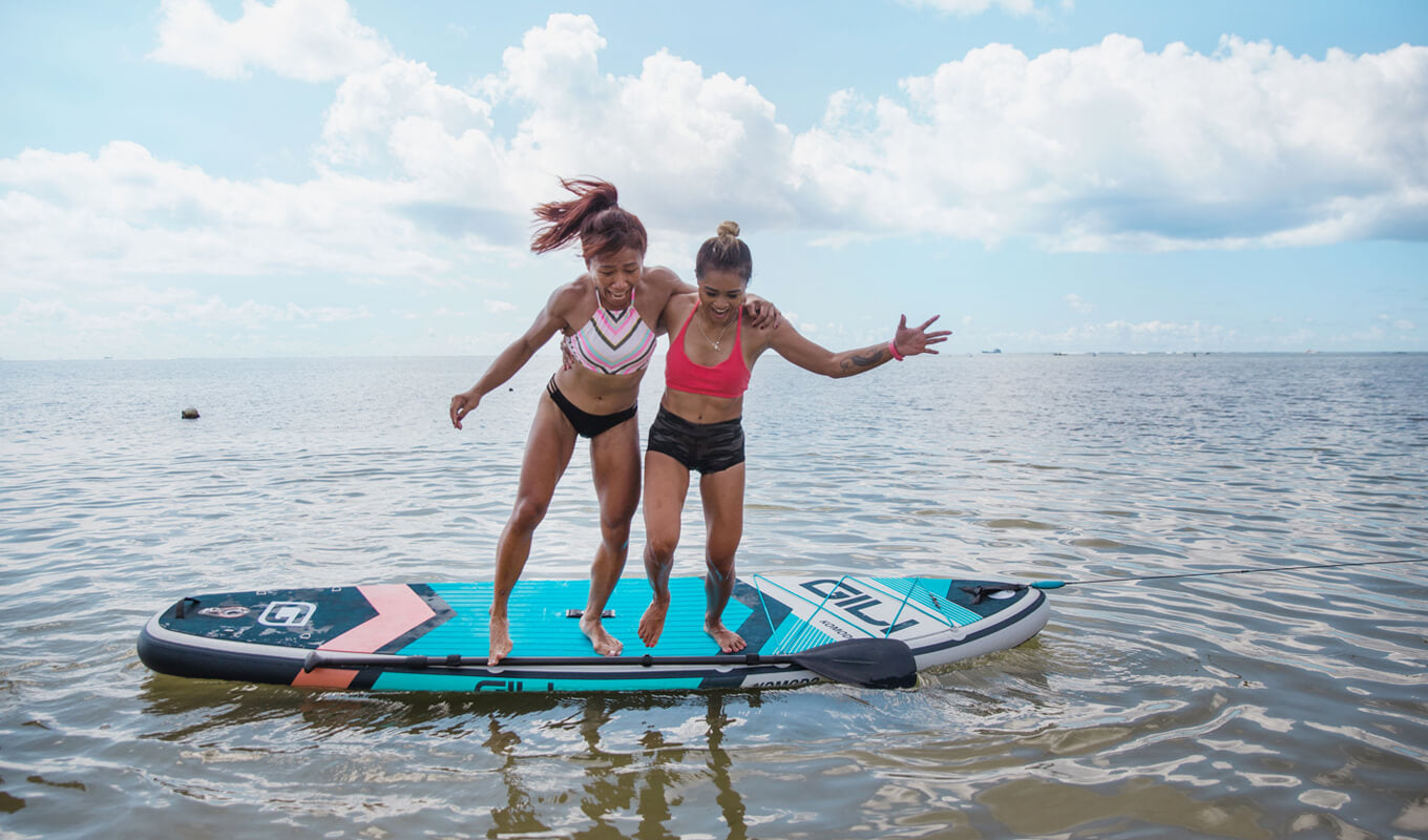 Two woman falling on the side of a board GILI komodo