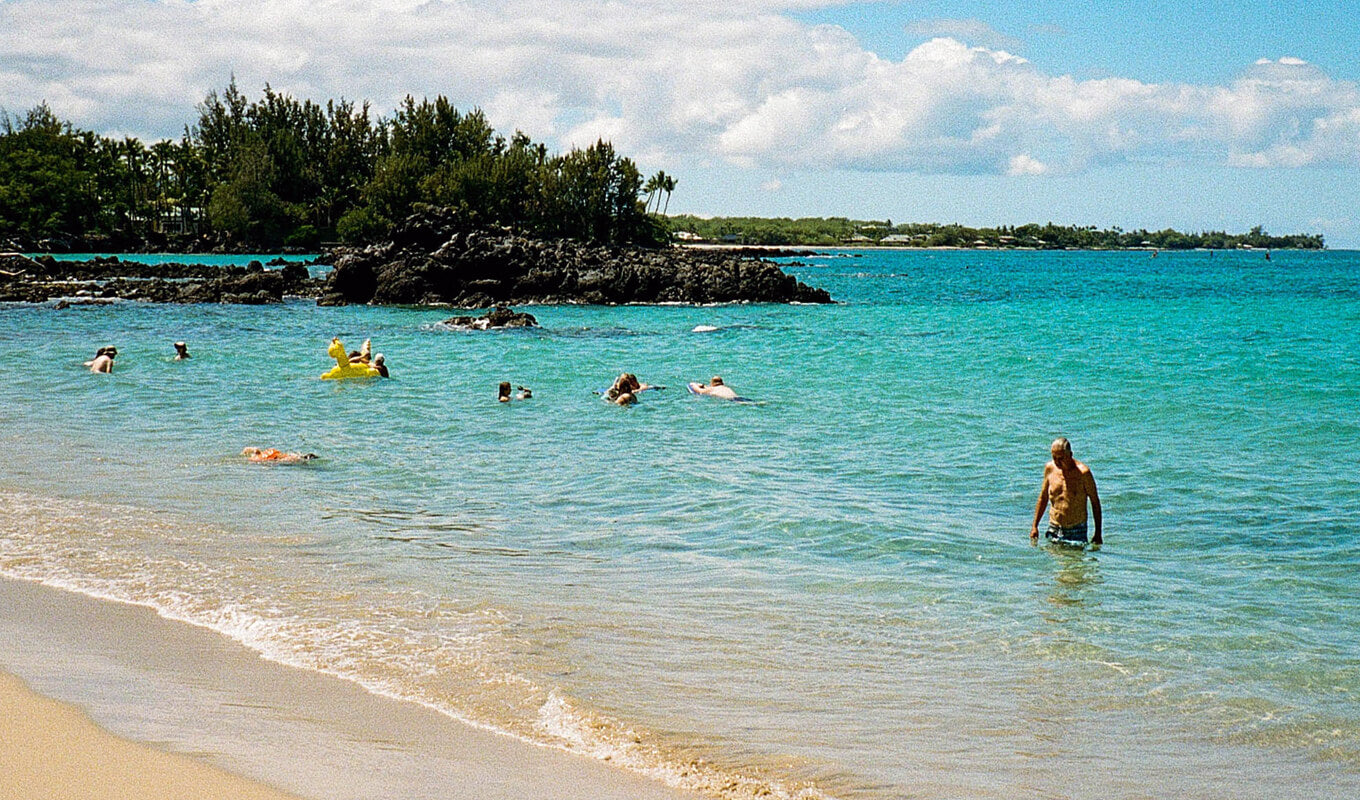 A person swimming in the ocean at Kona, Hawaii