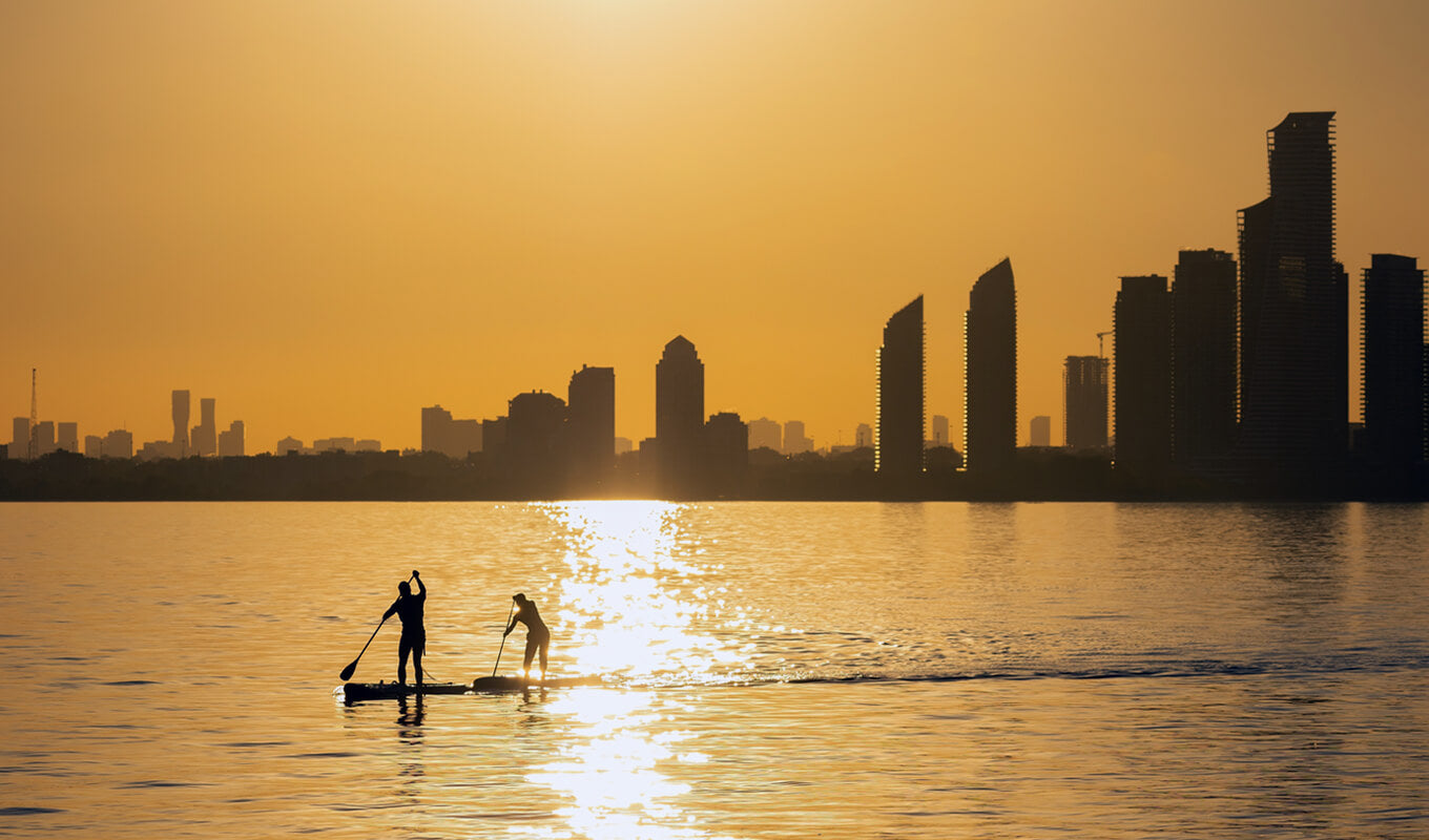 Man paddle boarding in the sea at Toronto, Canada