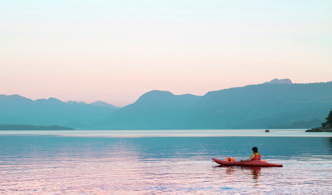 A man kayaking on the lake of Pucon, Chile