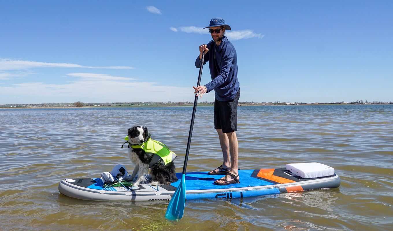 Man paddle boarding with a protective gear