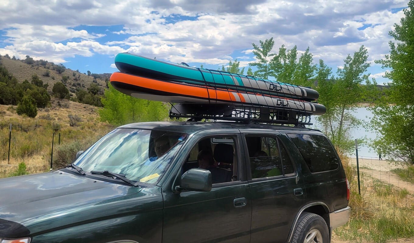 GILI paddle boards on a car roof rack