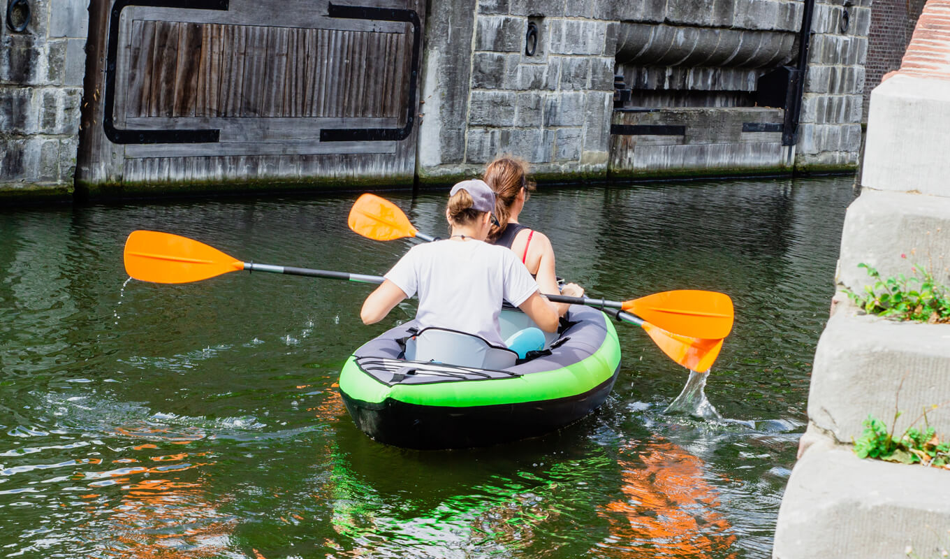 Tandem inflatable kayak on body of waters