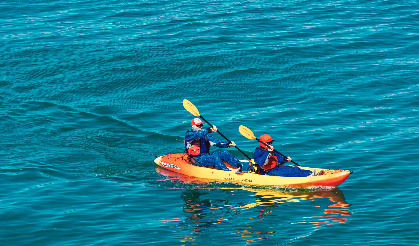 Man and woman on a ocean kayak tandem kayak