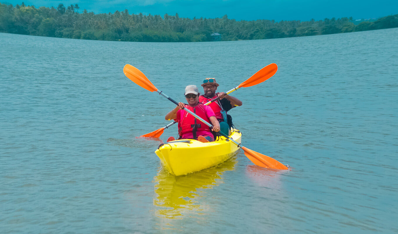 Couple on a yellow tandem kayak