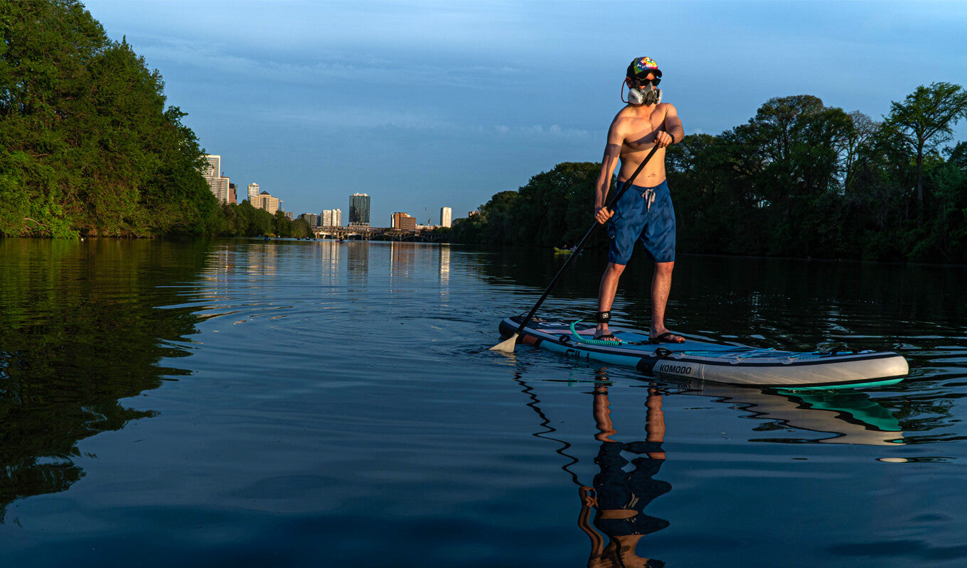 Man paddle boarding in a river using GILI Komodo sup