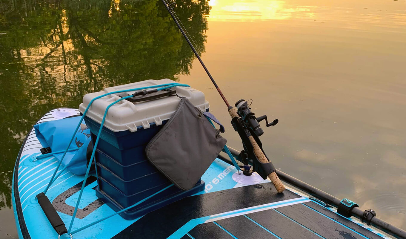Paddle board with fishing accessories