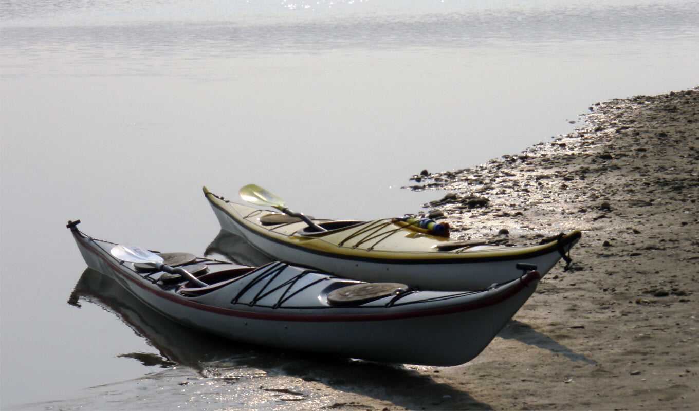 Kayaks on the beach shore