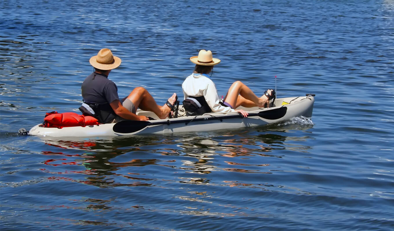 Man and a woman on a pedal kayak