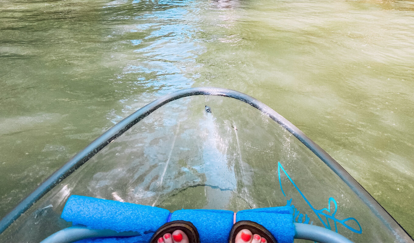 Clear bottom kayak on a river