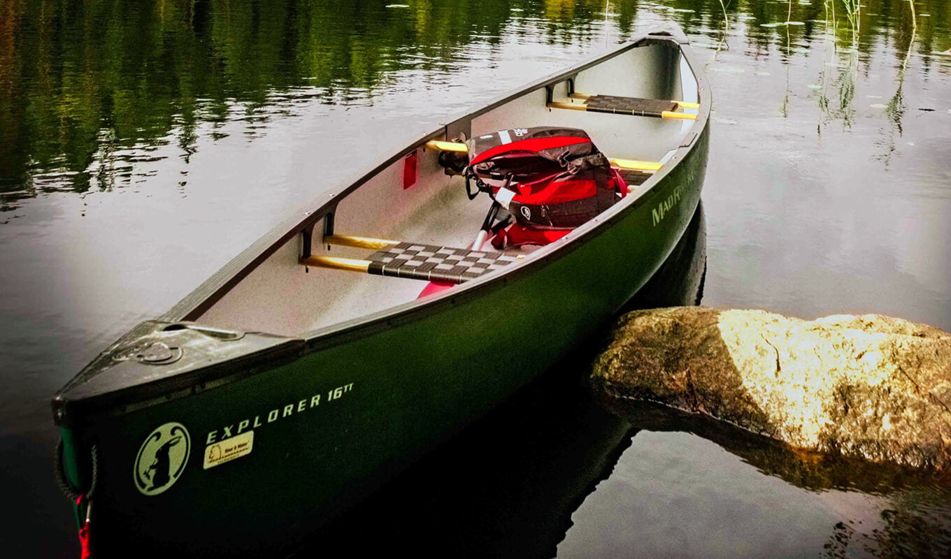 Green fiberglass canoe